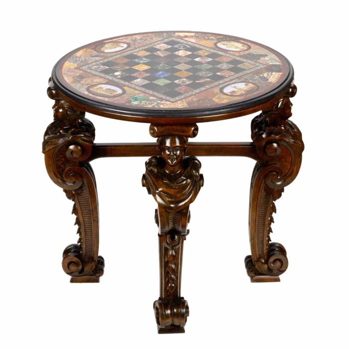 An impressive chess table with precious Roman mosaics on carved legs. 