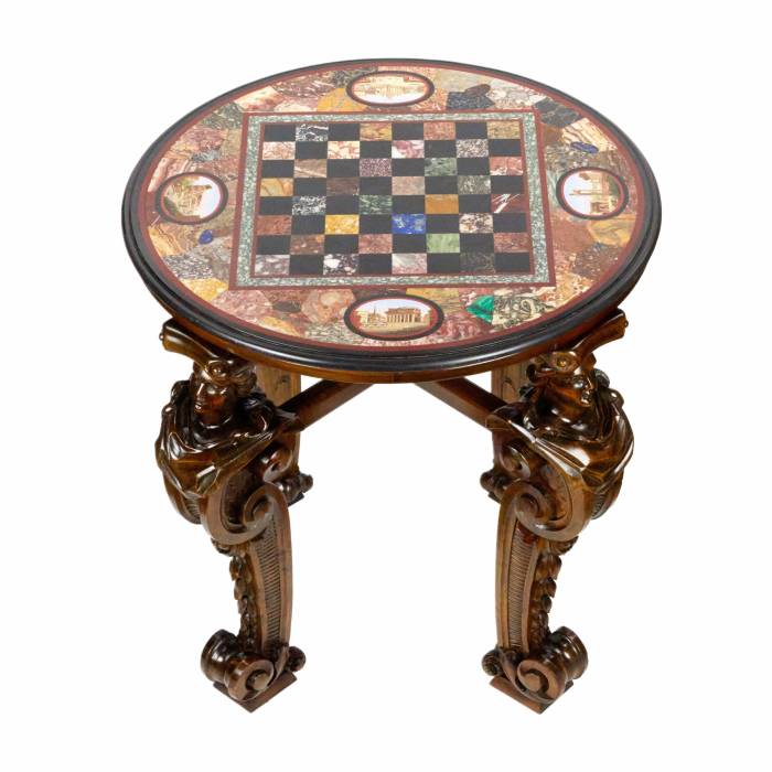 An impressive chess table with precious Roman mosaics on carved legs. 