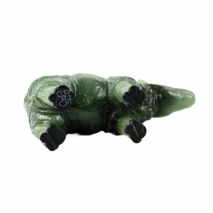 Stone-cutting miniature Jade rhinoceros in the style of products from the Faberge firm