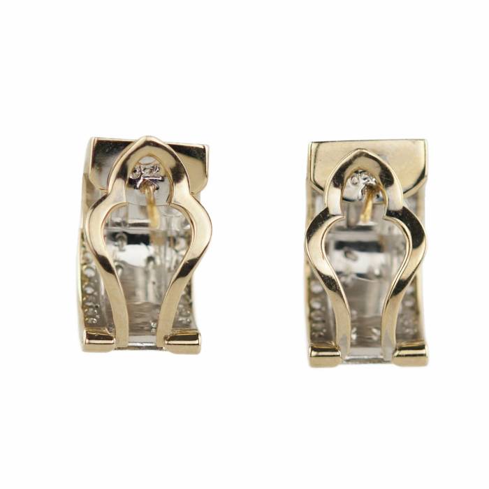 Ribbon, semicircular, two-tone gold earrings, 750 assay value, with diamonds. 13.28 gr. 