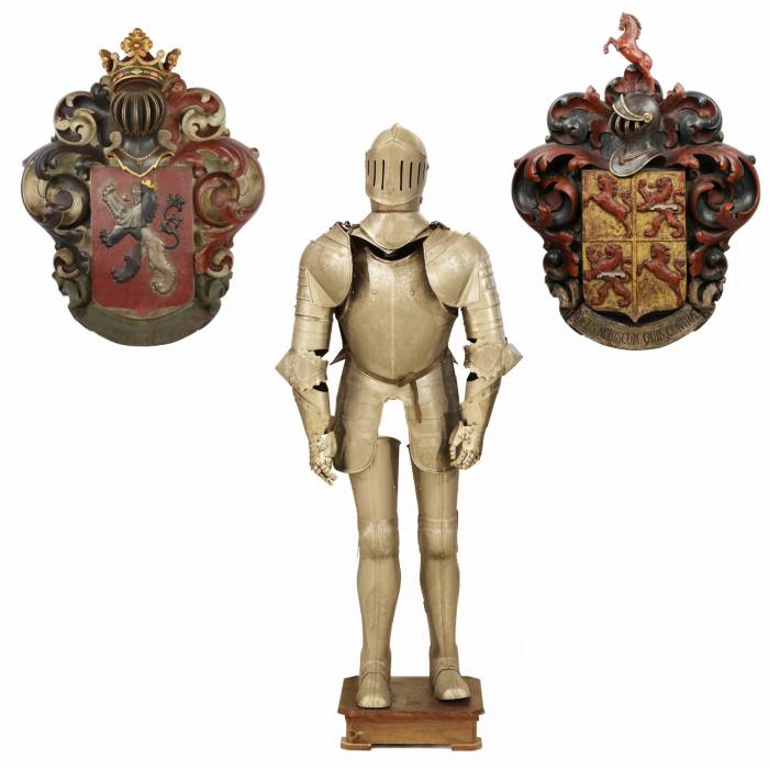 Large, carved, wooden coat of arms depicting a knight`s helmet topped with a crown. 19th century. 