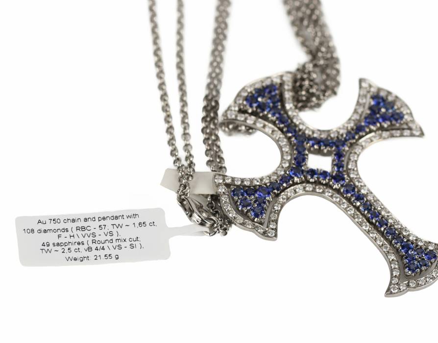  18K white gold cross, Italian workmanship, with sapphires and diamonds. 