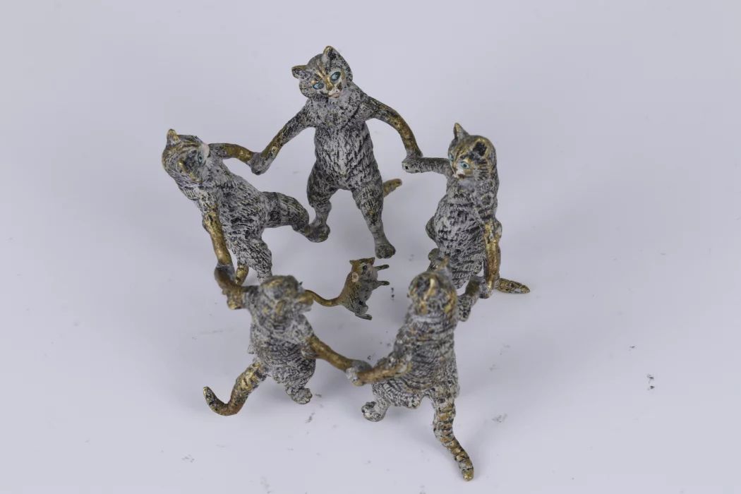 Dance of cats with a mouse. Vienna bronze