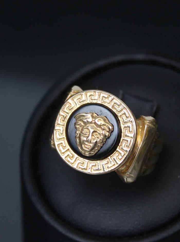 Women`s gold ring with onyx Gorgon jellyfish