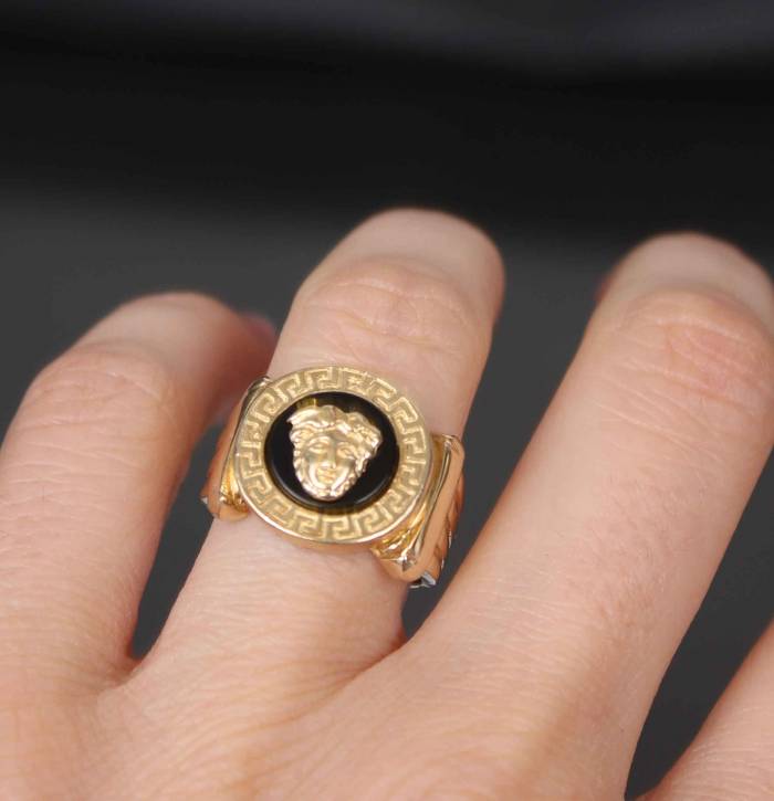 Women`s gold ring with onyx Gorgon jellyfish