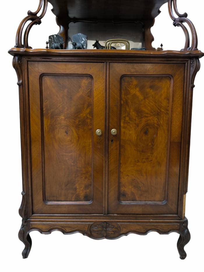 A small walnut sideboard with mirror and shelves