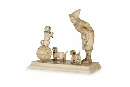 Figurine of an oriental clown with dogs.