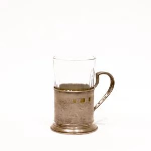 Silver cup holder with a glass.