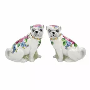 A pair of Pugs figures.