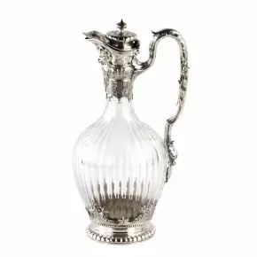 Silver wine jug in 16th century austere male dress. 