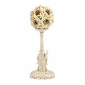 Chinese carved bone puzzle ball with stand. 